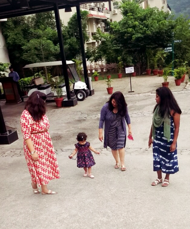 baby and aunts walking