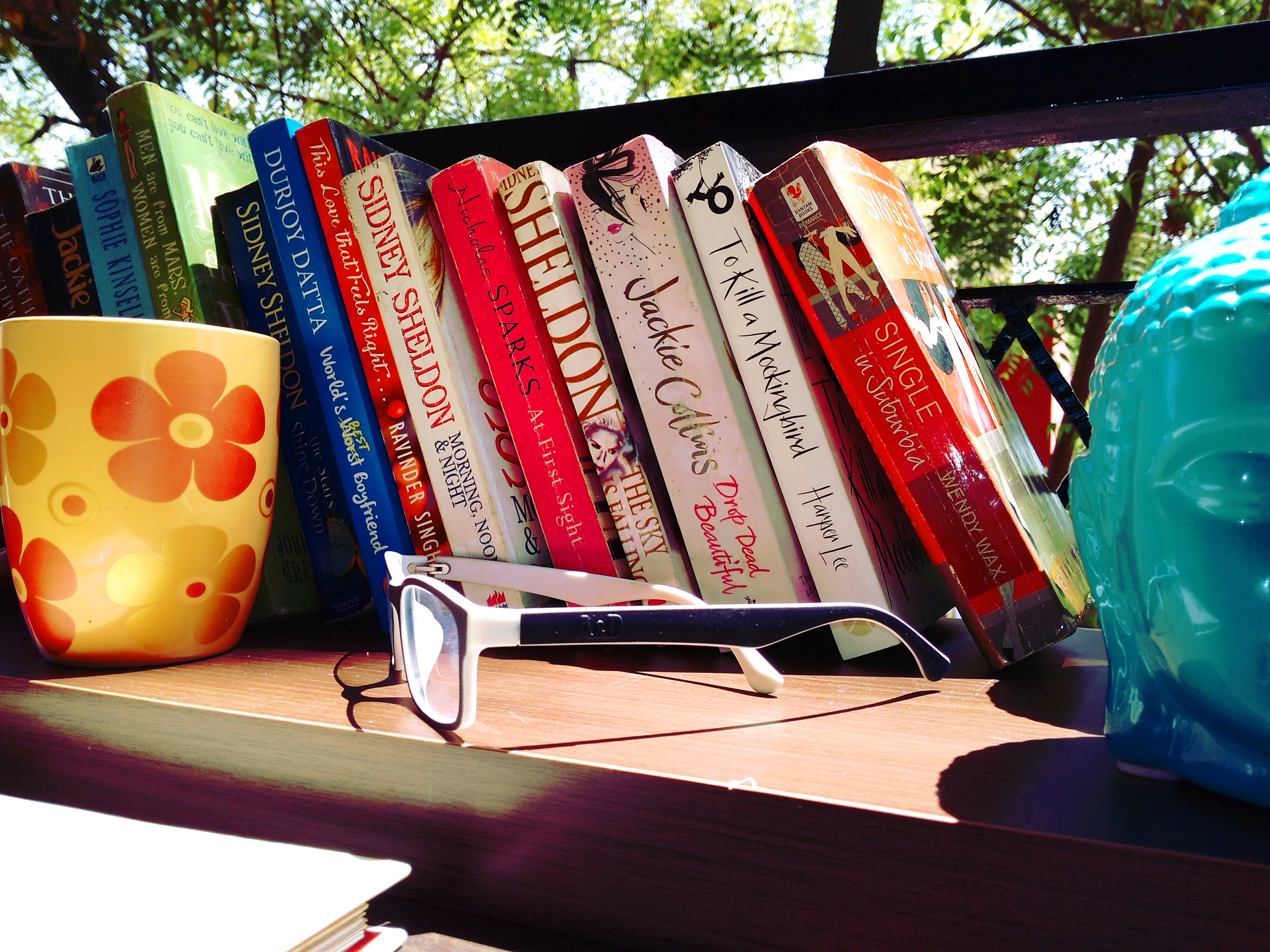 cup, specs, books