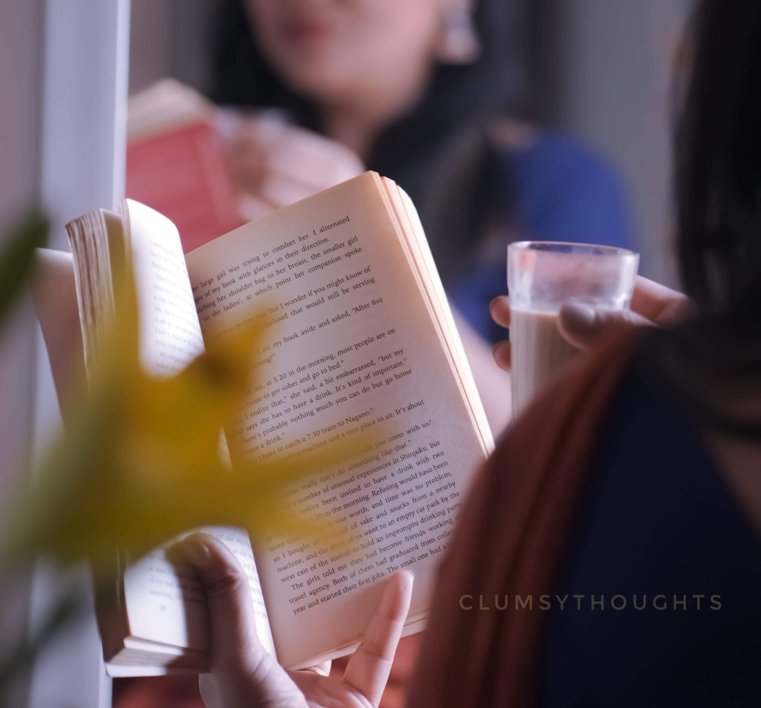 Gratitude, A woman is holding a tea cup and reading a book