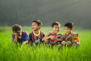 Kids sitting on grass, Discipline